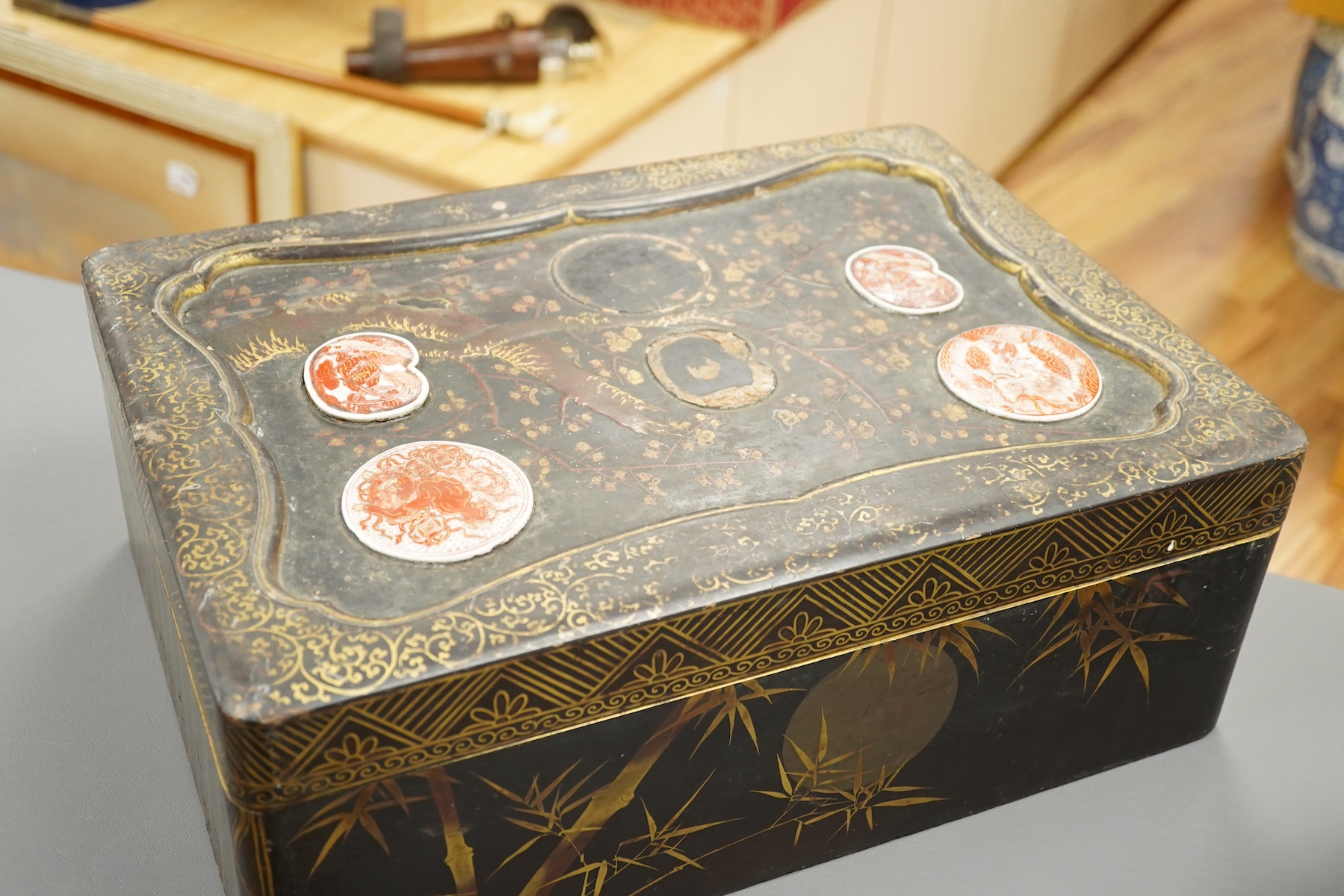 A 19th century Chinese export lacquer box containing assorted mother-of-pearl gaming counters and a 19th century Japanese lacquer box, largest 42.5cm wide. Condition - fair